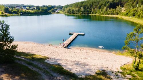 an aerial view of a dock on a lake at Agroturystyka Kaszuby in Wojsk
