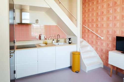 Kuchyň nebo kuchyňský kout v ubytování Design Hotel Modez