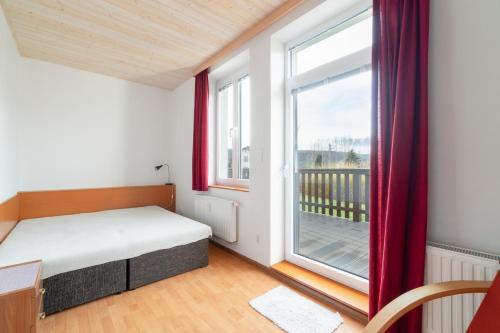 Postel nebo postele na pokoji v ubytování Apartmán Karlovice