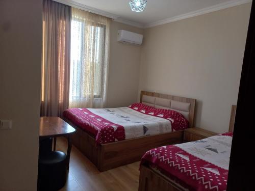 Postel nebo postele na pokoji v ubytování Mate's GUEST HOUSE