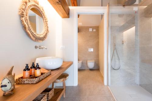 a bathroom with a sink and a shower at Villa Giulia Relais & Spa in Jesolo