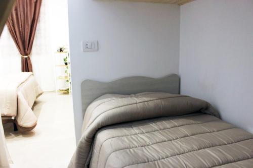 a bedroom with a bed in a room at Beb Cuore del Salento in Merine