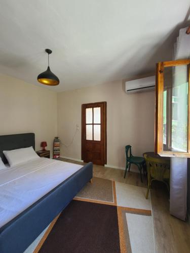Postel nebo postele na pokoji v ubytování Guraziu Home