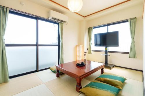 TV a/nebo společenská místnost v ubytování 静心宿Tranquil Retreat 4F晴空塔直达东京河景民宿