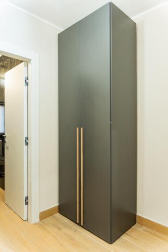 a large gray wardrobe in a room at Domus Suite Herculaneum jacuzzi in Ercolano