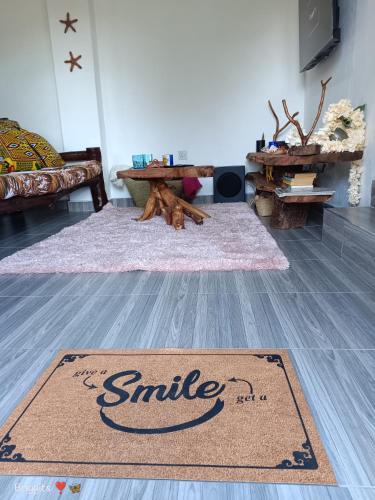 a rug on the floor of a living room at Hellenas Gem in Ukunda