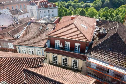 an overhead view of roofs of houses in a town at Casa Galvão Arcos de Valdevez in Arcos de Valdevez