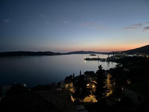 a view of a large body of water at dusk at Villa Oasis in Trogir