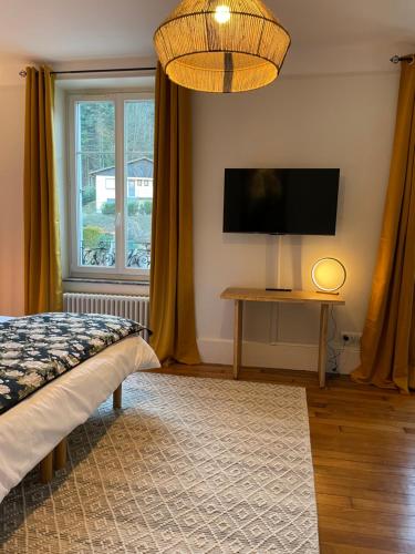 Ένα ή περισσότερα κρεβάτια σε δωμάτιο στο Chambre suite Arnica