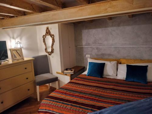 Postel nebo postele na pokoji v ubytování Cà Ro - Casa Rosetta "Mini house"
