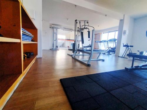 a room with a gym with two treadmills and a treadmill at Saint Sebastian ap115 -stúdio para casal in Jaraguá do Sul