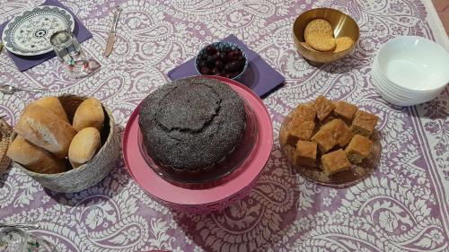 a table with pastries and bread on a table at Casa Rural Italuna in Jarque de la Val