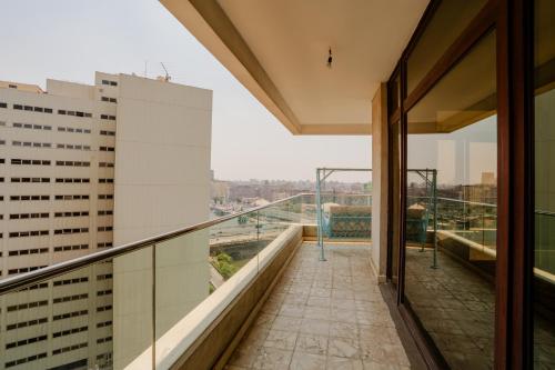 a balcony with a view of a city at Om Kolthoom Hotel in Cairo