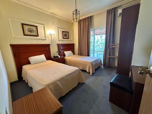 Postel nebo postele na pokoji v ubytování Le Crillon