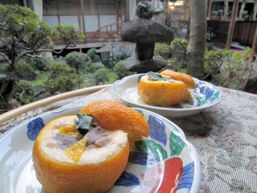 two plates of food sitting on a table at Ryokan Taishoro in Sakurai