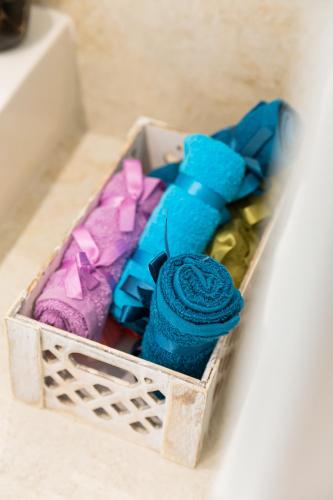 a wooden box filled with different types of ties at Mira Marina in Masouri