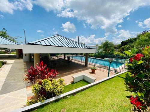 a house with a swimming pool and a patio at Modern Penthouse in Carolina in Cuatro Caminos