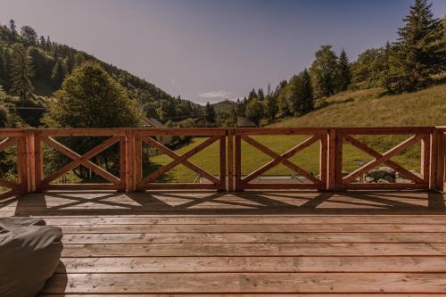 a wooden bridge with a view of a mountain at Rycerki Dom na Szlaku in Rajcza