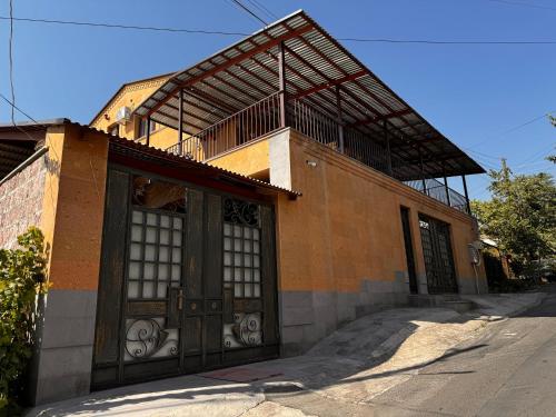 a building with a large door on a street at Velvet Vouge Hostel in Yerevan