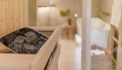 a bowl of rocks sitting on top of an oven at Rycerki Dom na Szlaku in Rajcza