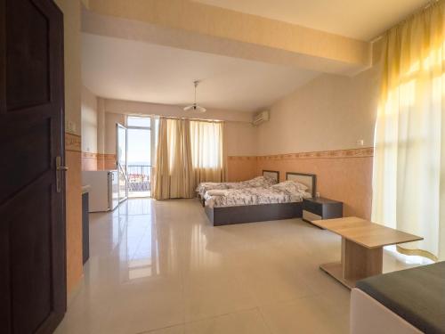 Ένα ή περισσότερα κρεβάτια σε δωμάτιο στο Guest House Rubin