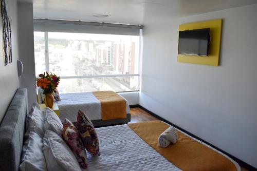 TV a/nebo společenská místnost v ubytování Hotel Aristo Tunja