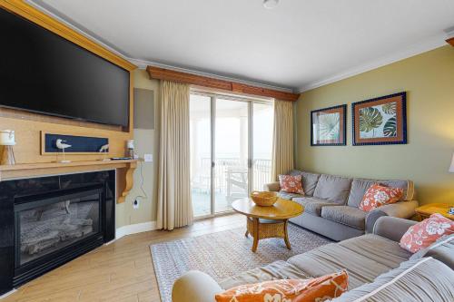 a living room with a couch and a fireplace at Belmont Towers 801 in Ocean City