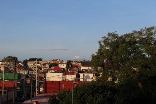 a view of a city with a mountain in the background at Flat Apartment in Downtown Xalapa Veracruz in Xalapa