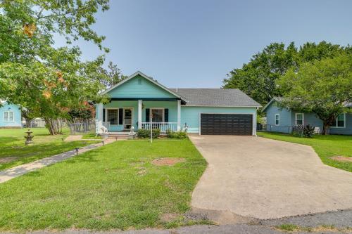 a blue house with a driveway in front of it at Eufaula Home - Walk to Lake Beach! in Eufaula