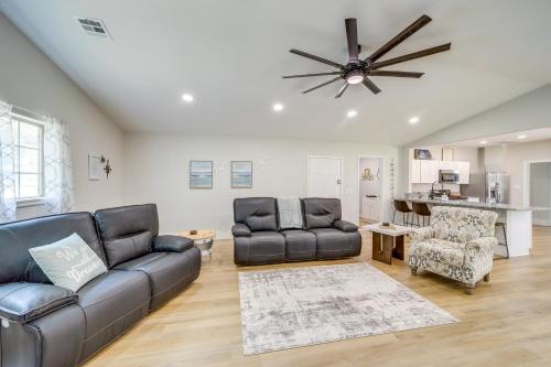 a living room with two couches and a ceiling fan at Eufaula Home - Walk to Lake Beach! in Eufaula
