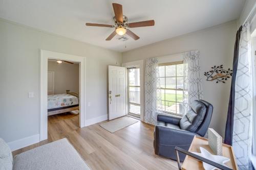 a living room with a ceiling fan and a couch at Eufaula Home - Walk to Lake Beach! in Eufaula