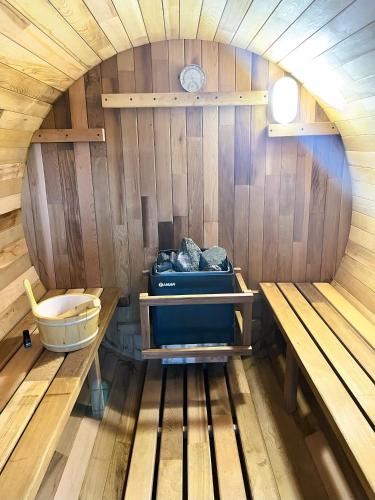 an inside view of a sauna with a table and bench at Summer Tiny House in West Palm Beach
