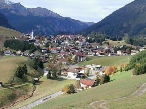 a small town in a valley in the mountains at Gästehaus Bergland in Berwang