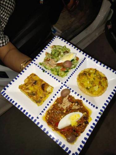 a plate with different types of food on it at Dar Morjana in Sousse