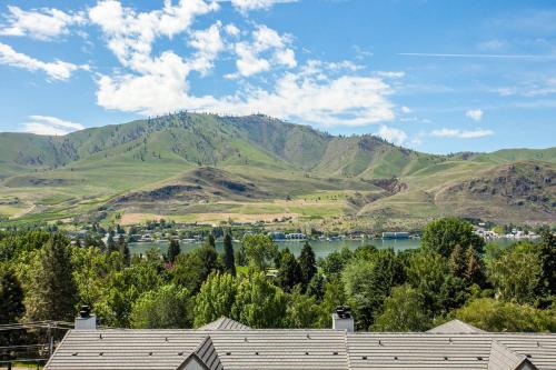 a view of a mountain with a lake and houses at Park Pointe: (A103) in Chelan