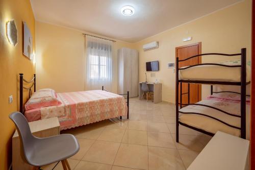 Postel nebo postele na pokoji v ubytování Il cappello sulle 23! Camere in affitto breve