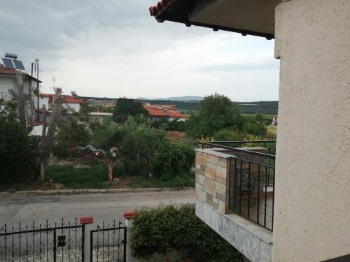 a view of a street from a balcony of a building at Nansy's house in Áyios Pávlos
