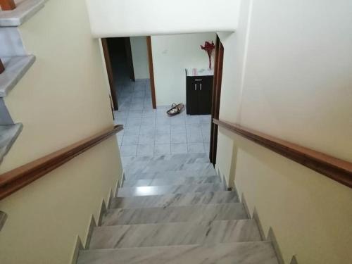 a view of a hallway with stairs in a building at Nansy's house in Áyios Pávlos