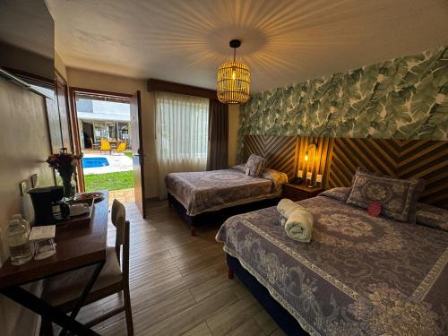 Postel nebo postele na pokoji v ubytování Hotel Isabel