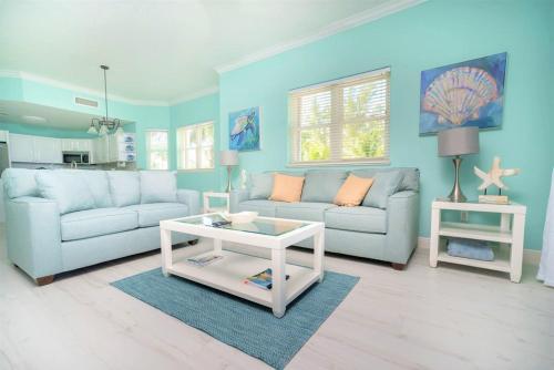 a living room with a couch and a table at On The Bay in North Side