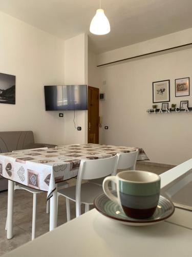 a coffee cup sitting on a table in a kitchen at Casa Bianca in Iglesias