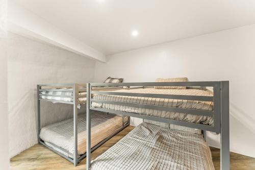 a bunk room with two bunk beds in it at Iconic Vail Dome Unit 2 in Vail
