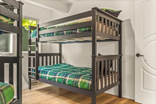 a bunk bed room with three bunk beds in a room at Iconic Vail Dome Unit 2 in Vail