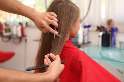 a girl getting her hair cut at a salon at Catty Cats Garden Hotel in Side