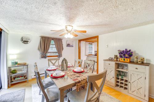 a dining room with a table and chairs at 6 Mi to Grandfather Mtn Peaceful Getaway with Grill in Newland