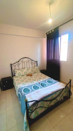 a bedroom with a bed in a room at Ikamat tililaa in Ait Melloul
