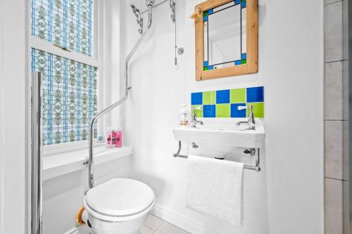a bathroom with a toilet and a sink at Luxury Apartment Peak District in Matlock