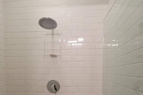 a shower with a cage on a tiled wall at Beautiful apartment in Casco Viejo, Casa Rio Apt #2 in Panama City