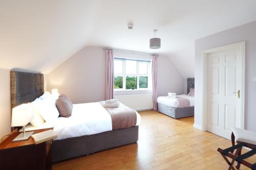 Postel nebo postele na pokoji v ubytování Ashville Guesthouse