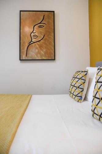 a painting of a man hanging on a wall at Les chambres du Palais Bastia Centre in Bastia